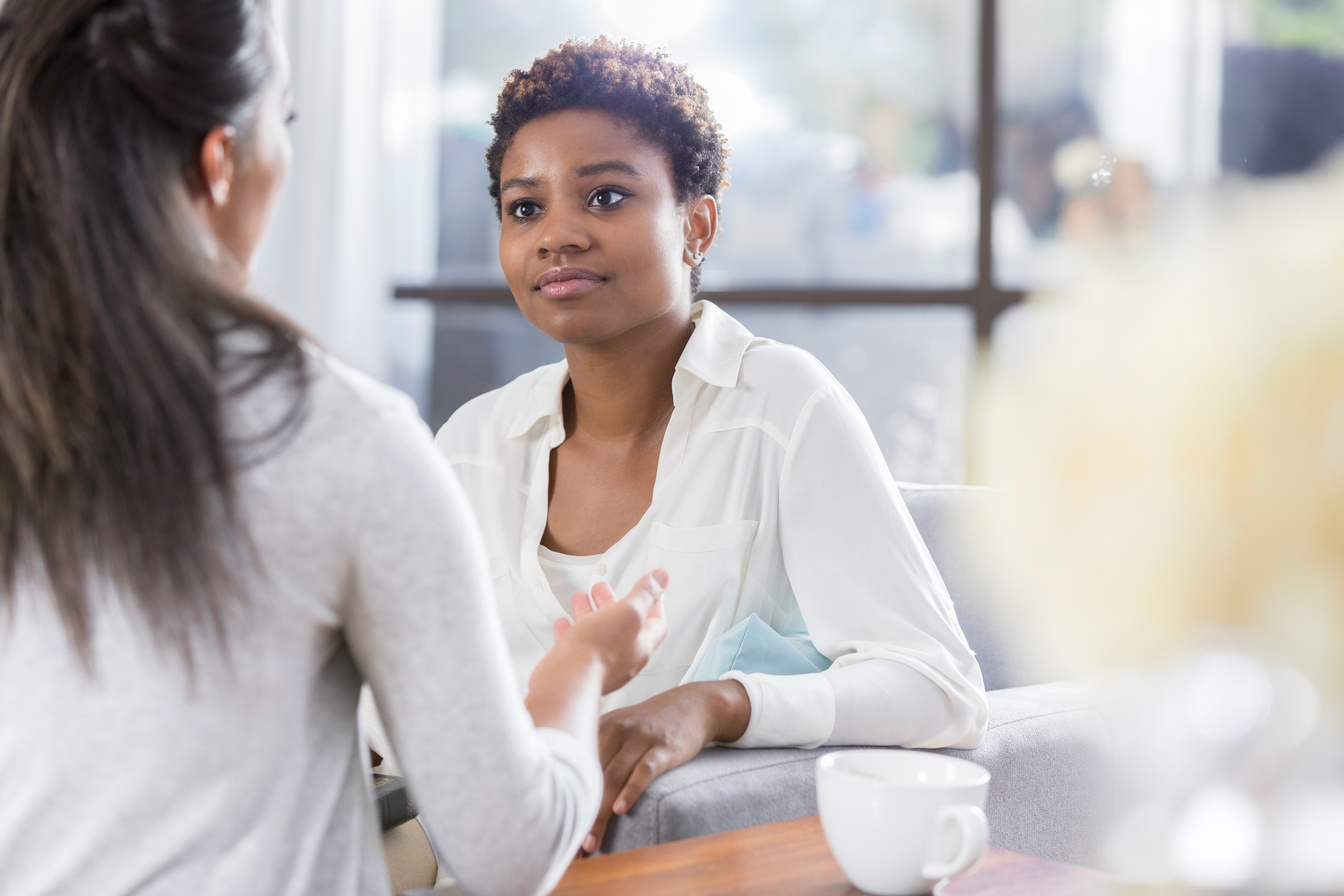 Therapist counsels female client